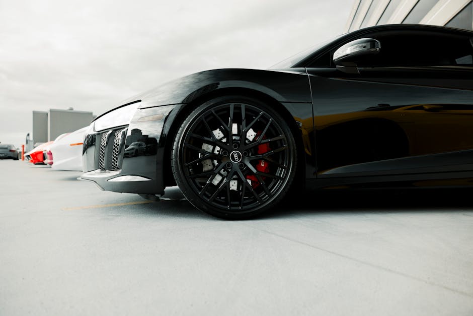 Glossy black sports car with fresh ceramic coating
